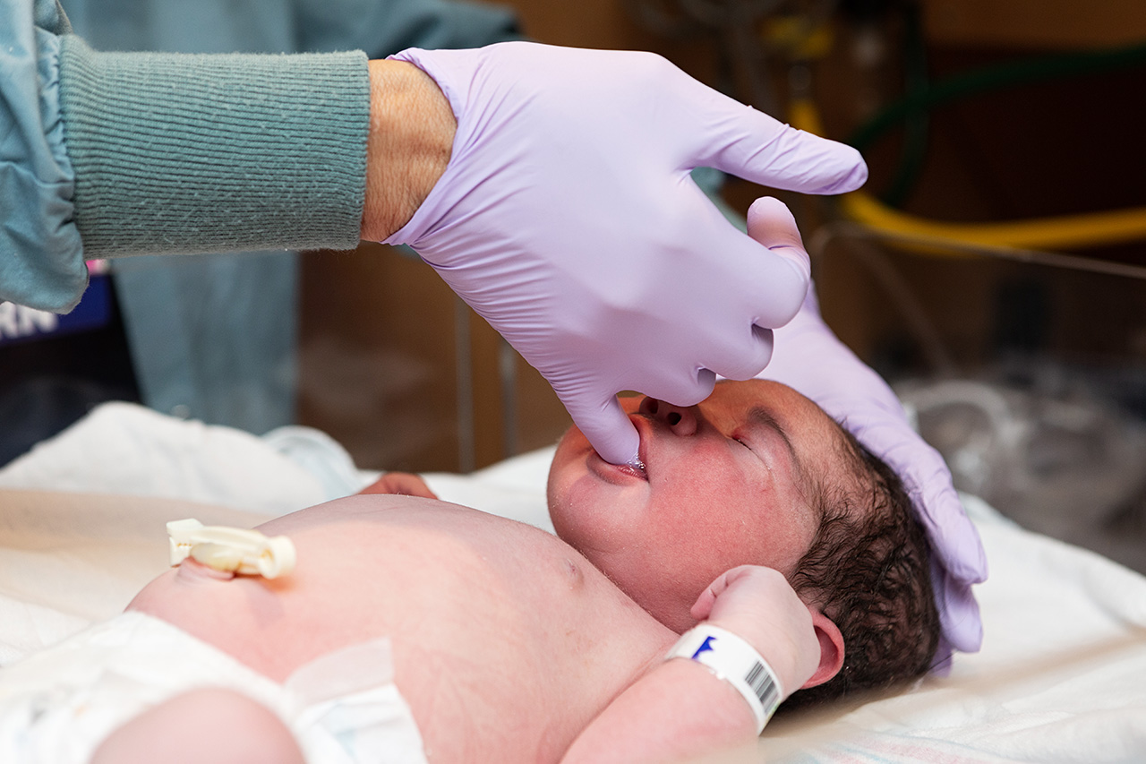 Newborn baby exam photo by Birth and Beauty